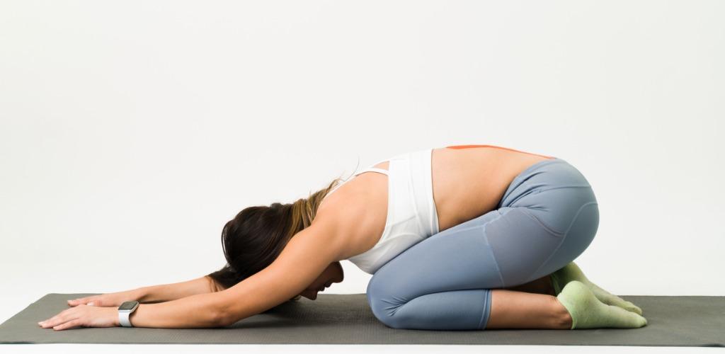 doing-an-extended-child-asana-pose-at-home-picture-id1323104807